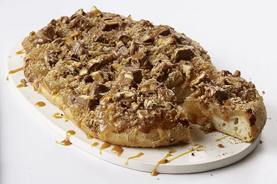 caramel-apple-crunch-pizza-made-with-twix-cookie bar marsfoodservices image